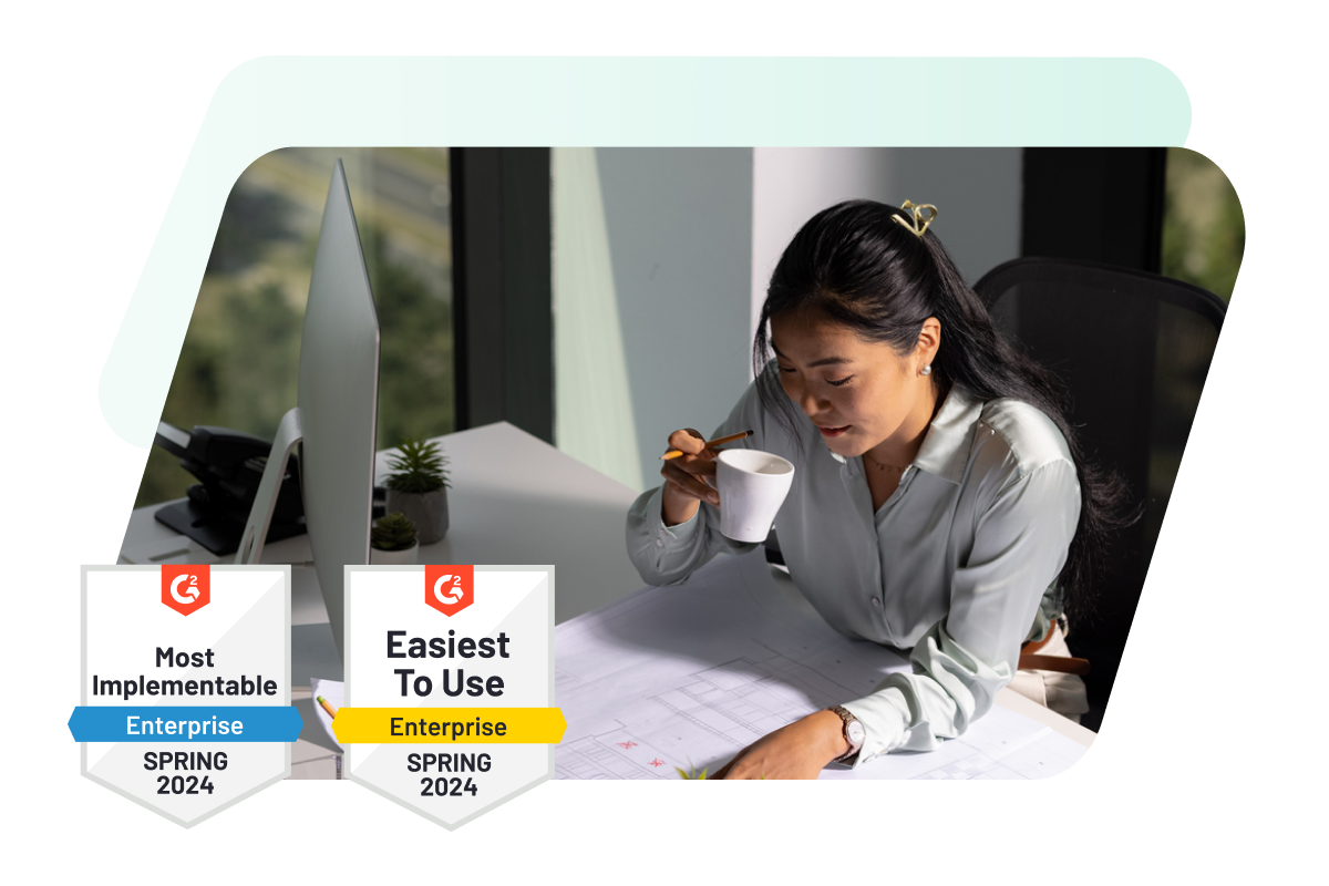 Image showing woman at her desk overlaid with two G2 badges awarded to Dashlane: “Most Implementable-Enterprise” Spring 2024 and “Easiest To Use - Enterprise” Spring 2024.