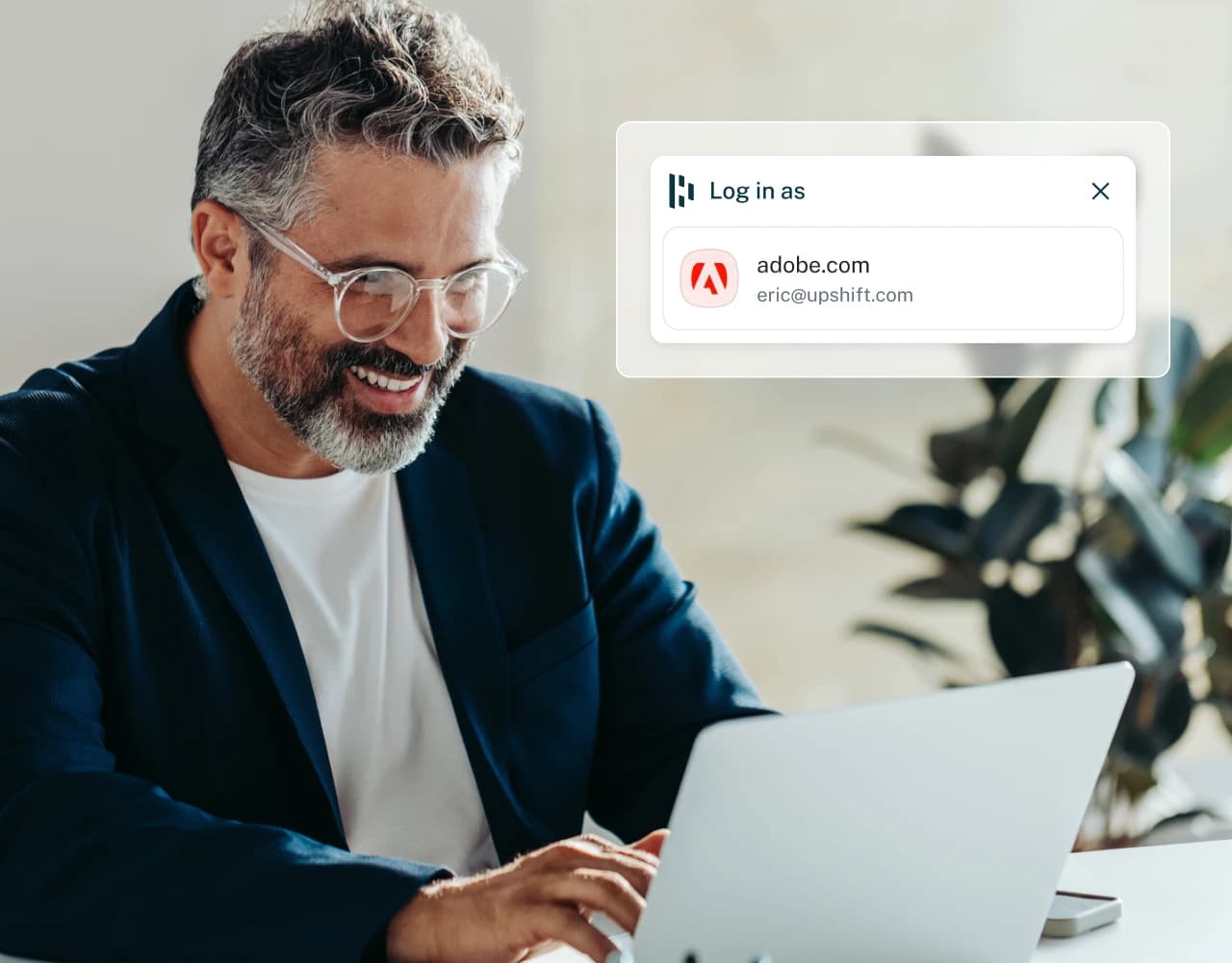 This image shows a man happily working on a computer overlaid with a screenshot of Dashlane Autofill.